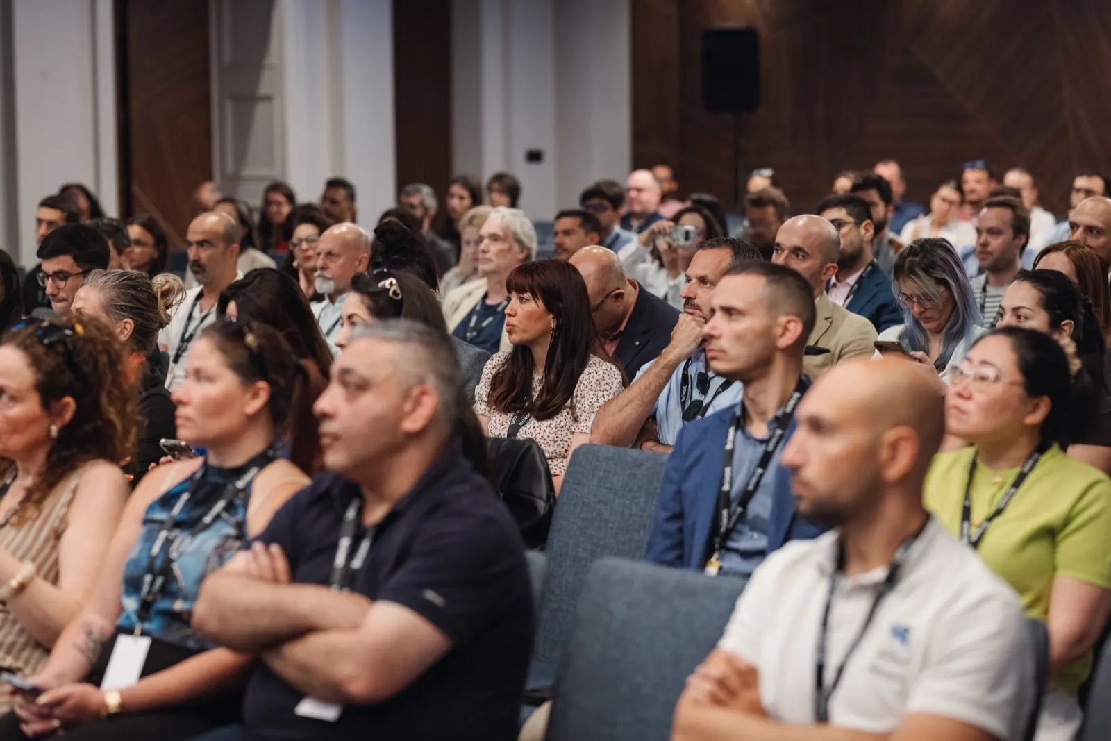 Attendees seated in a conference hall during a talk.